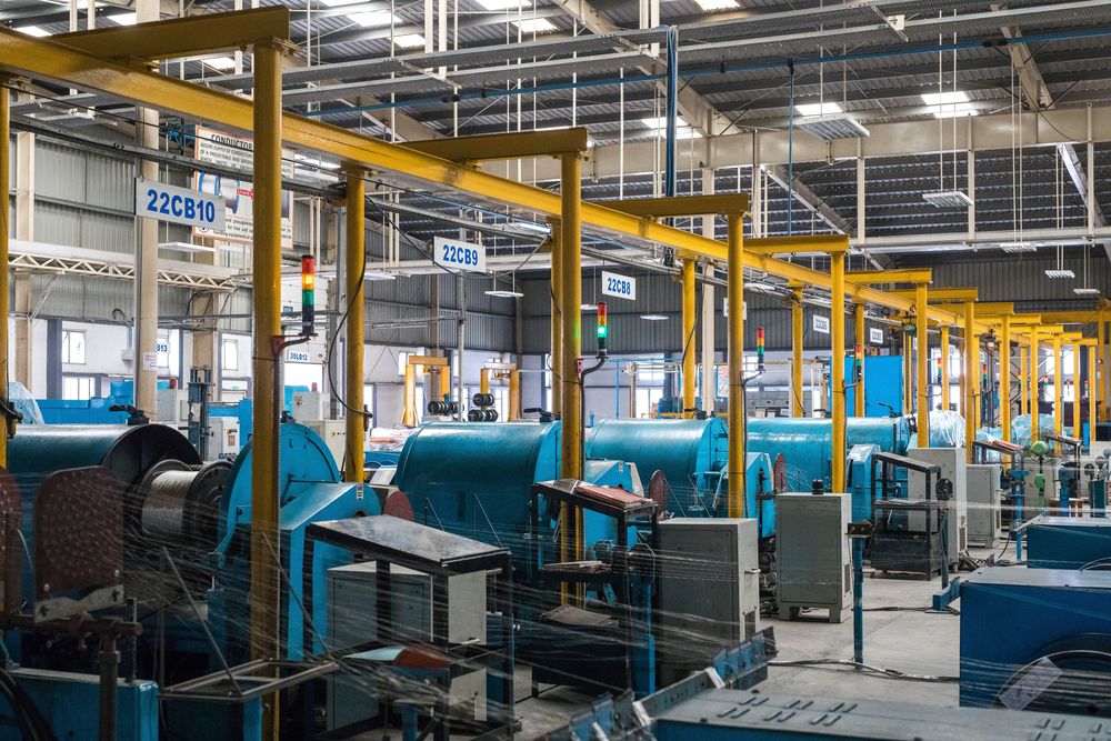 Cable manufacturing shop floor with overhead gantry